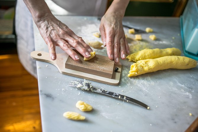 Cesarine: Market Tour & Cooking Class at Local's Home in Milan - Sitting down to the meal