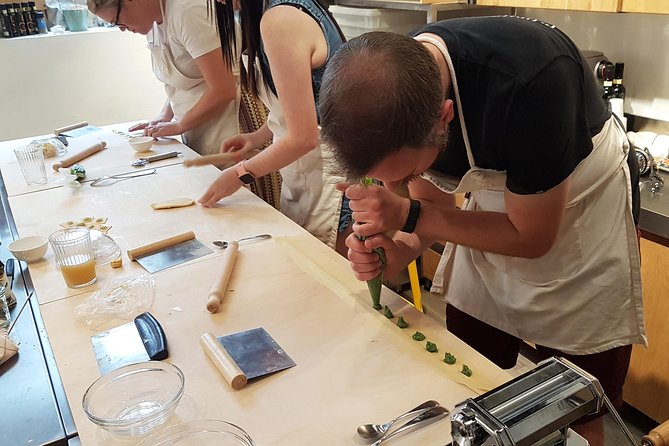 Italian Cocktail + Art of Making Pasta Cooking Class In Unique Milan Location - Sitting down to eat your own work