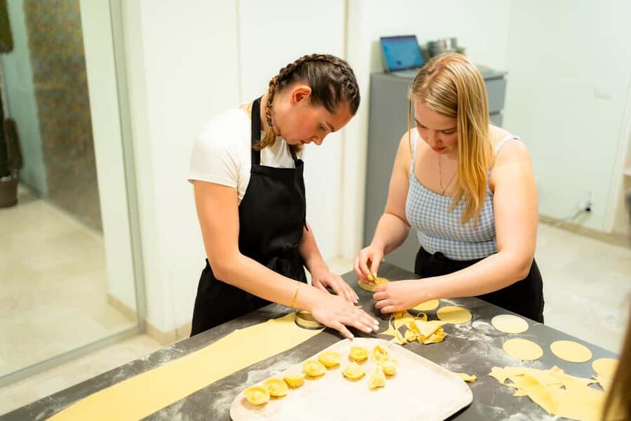 Milan: Pasta, Gnocchi and Tiramisù Cooking Class with Wine - Rolling pasta and filling ravioli