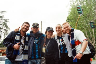 See a football game in Milan together with locals