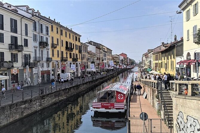 Sunset Navigli Boat Tour in Milan with Optional Aperitivo - Two historic churches along the water